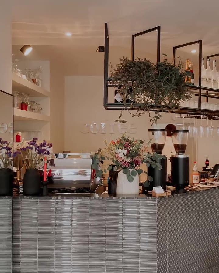 Coffee bar with fresh flowers at mi. cafe & bar