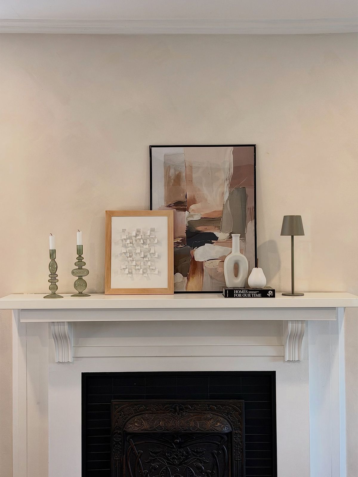 Earthy pastel fall decor on a white mantel